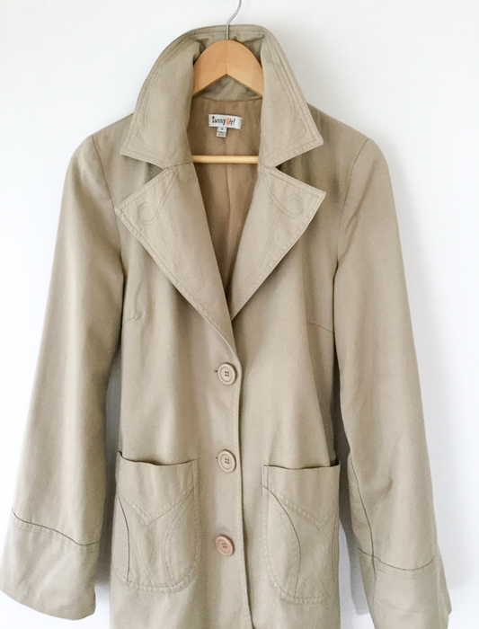 Neutral trench coat with sash