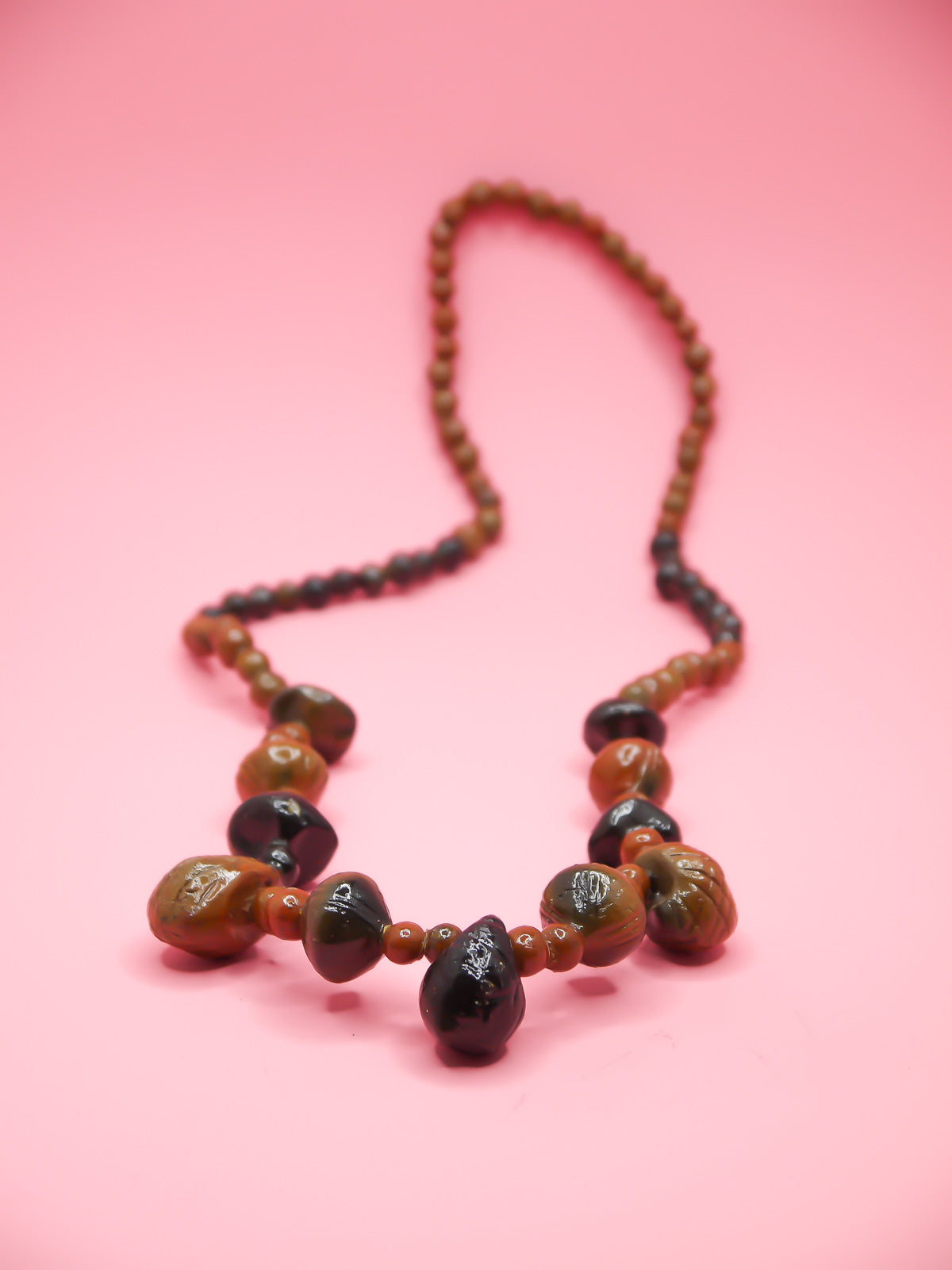 Chunky brown long wooden bead necklace with various sizes of wooden beads 