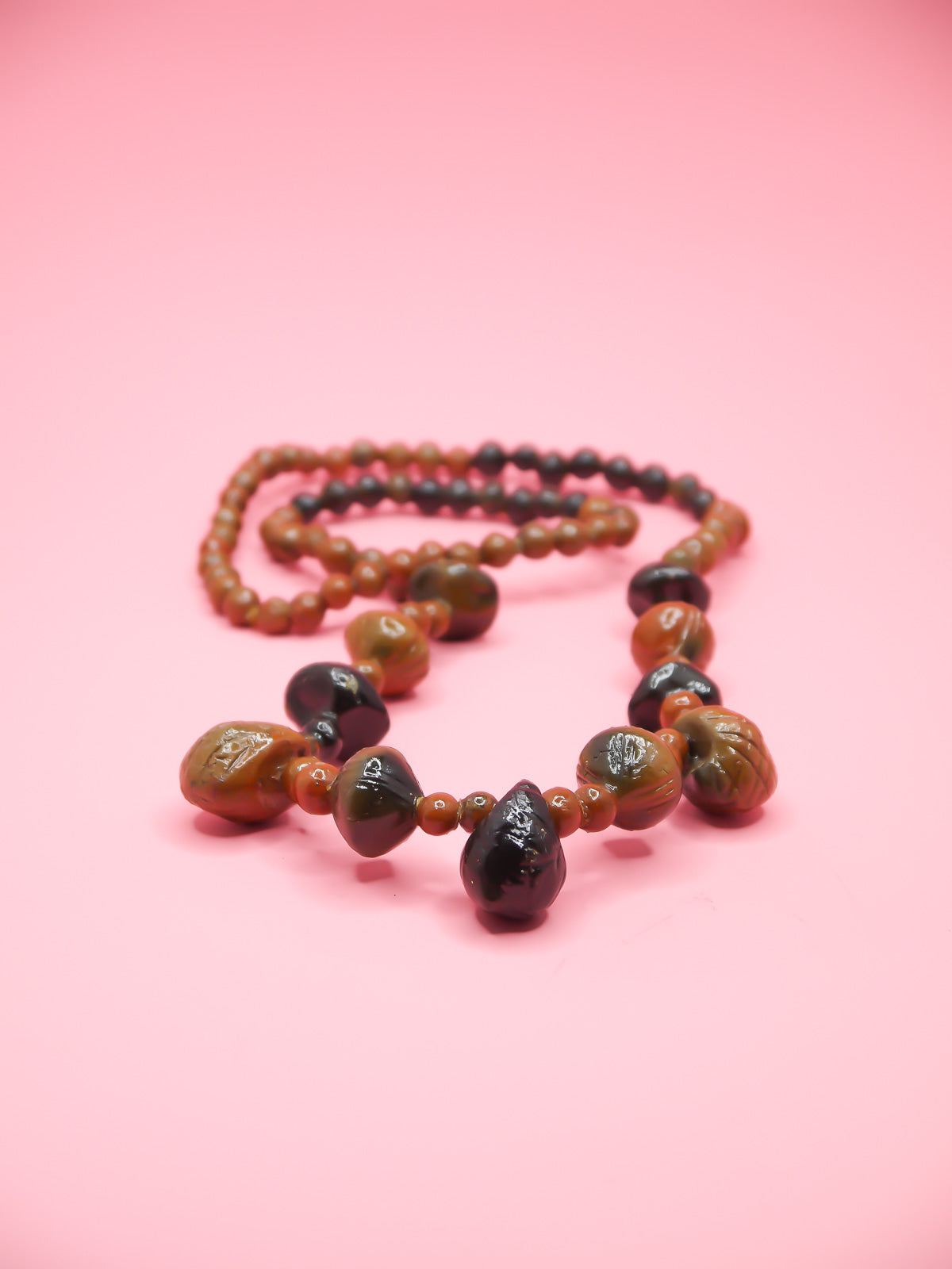 Chunky brown long wooden bead necklace with various sizes of wooden beads