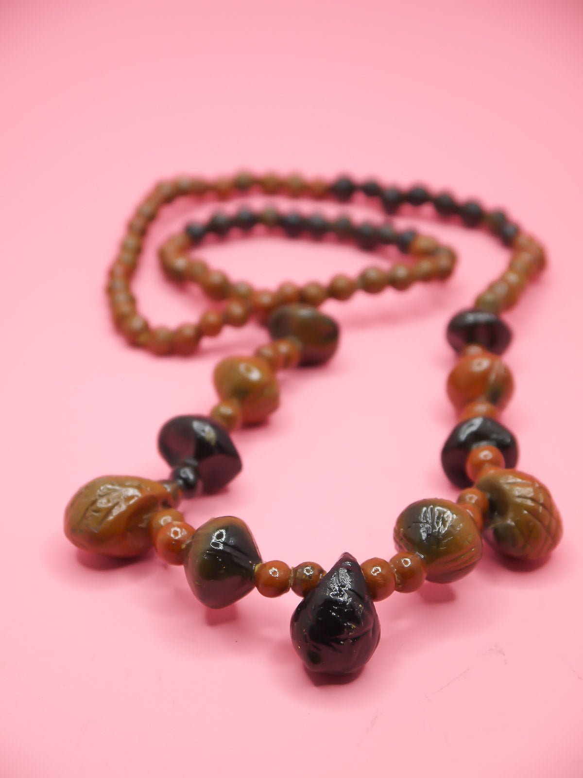 Chunky brown long wooden bead necklace with various sizes of wooden beads