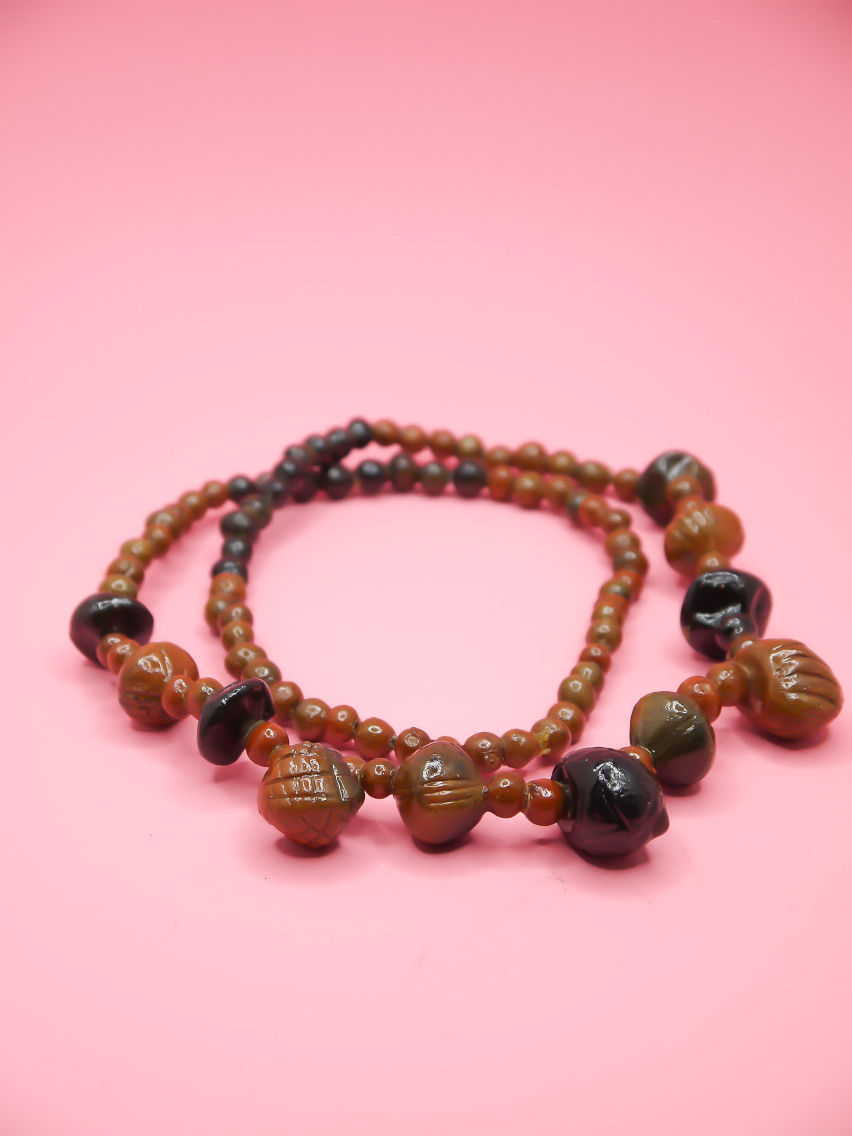 Chunky brown long wooden bead necklace with various sizes of wooden beads