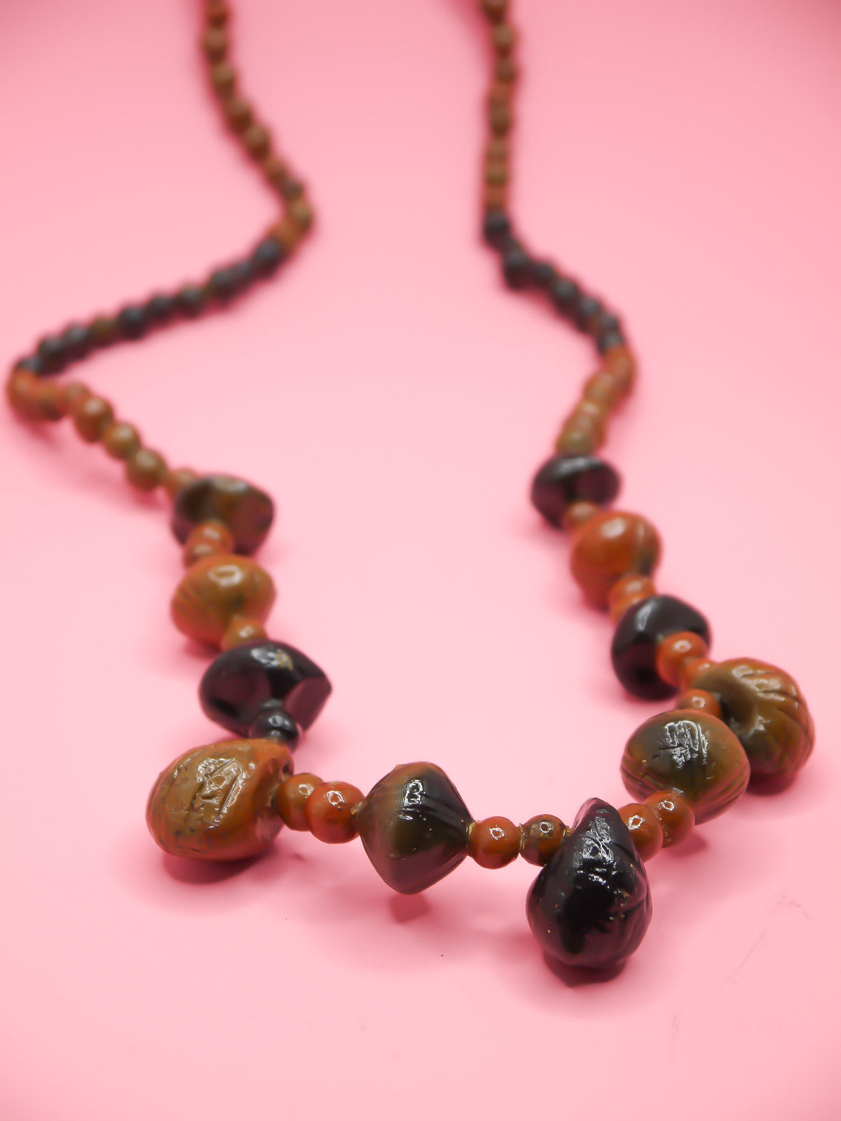 Chunky brown long wooden bead necklace with various sizes of wooden beads