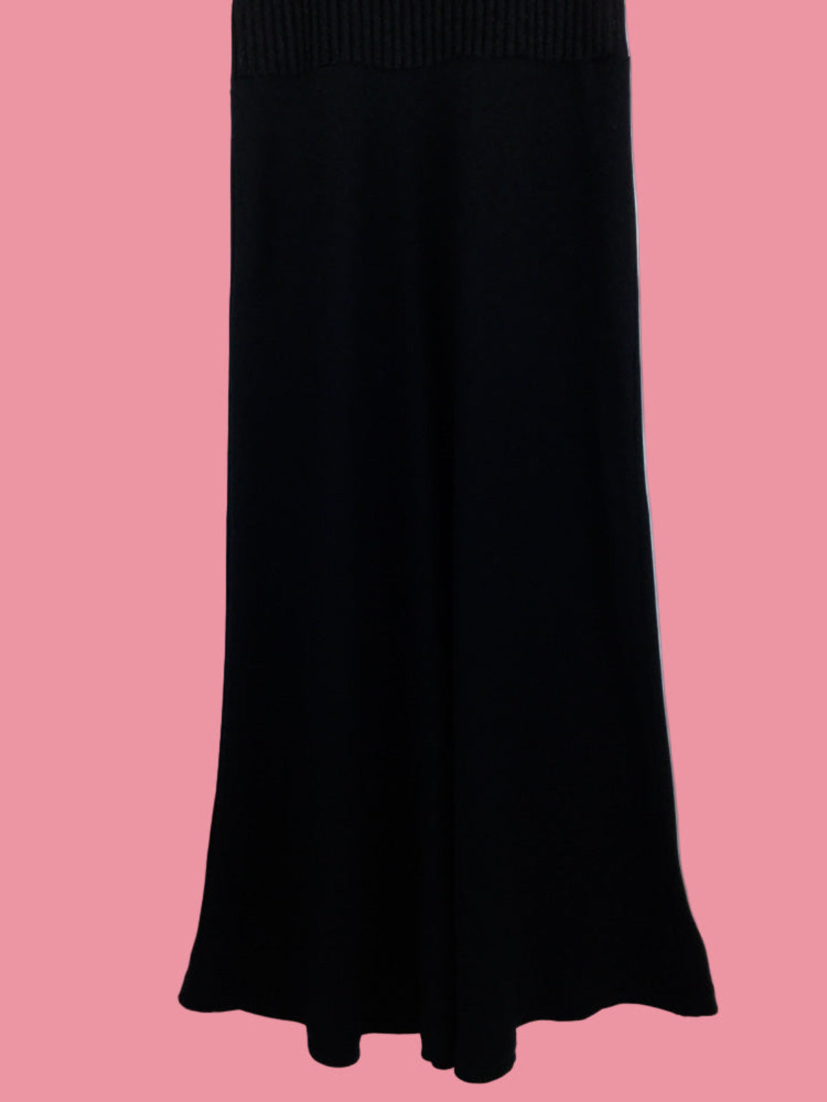 Black dress on a pink background