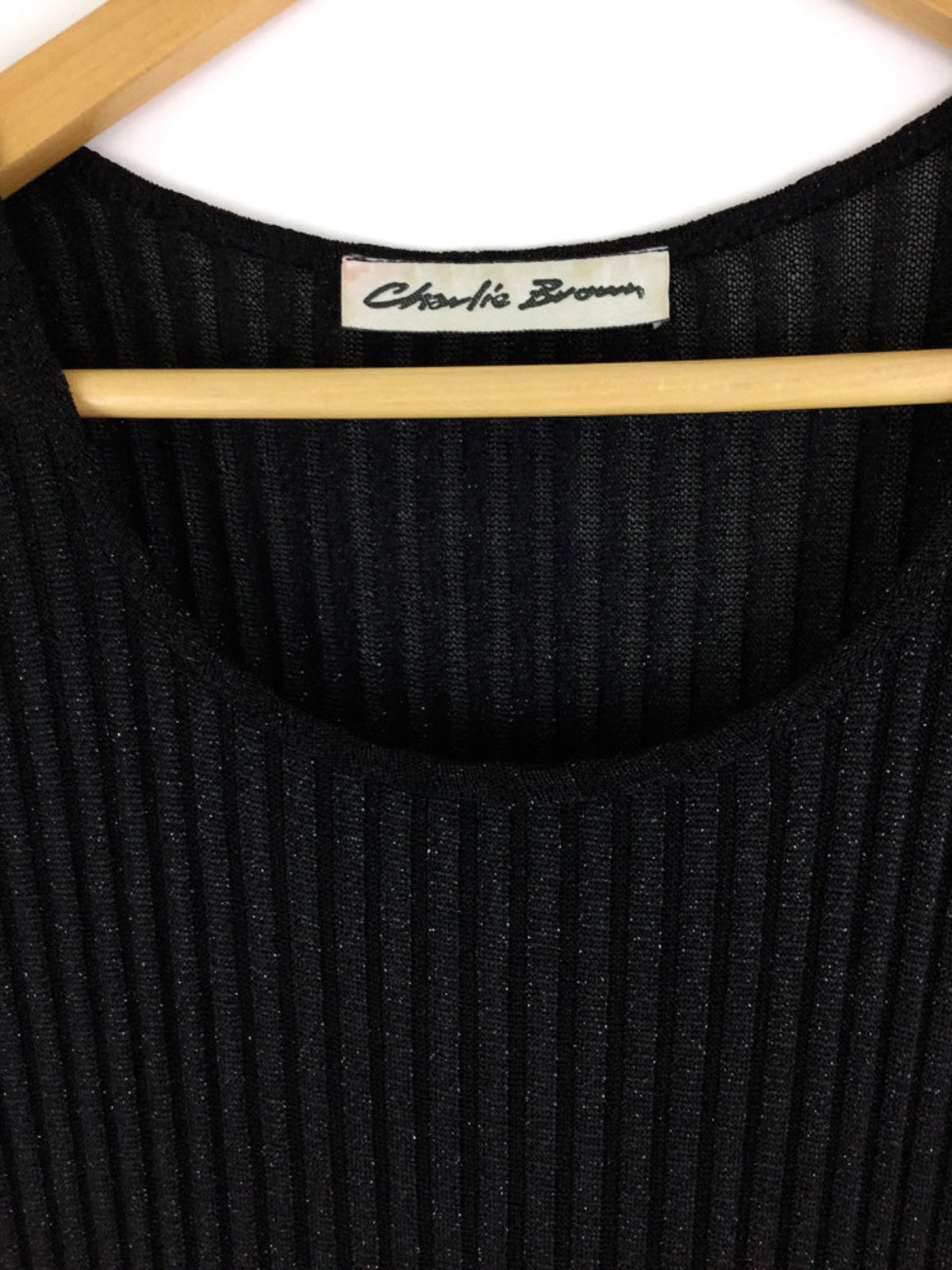 Black ribbed dress on a hanger with 'Charlie Brown' label.