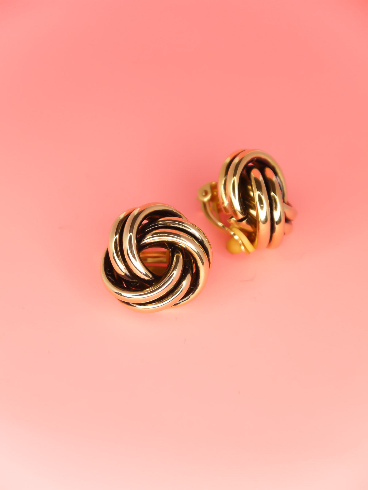 Vintage 80's gold tone and black knot swirl clip on earrings