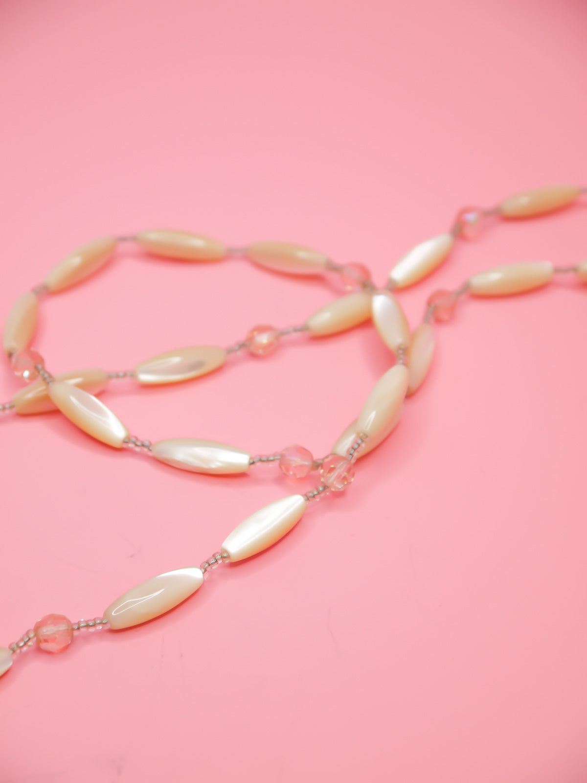 Vintage Mother of Pearl beaded long necklace with tube faceted pearl beads and pink crystal faceted beads with clear seed beads and a metal clasp