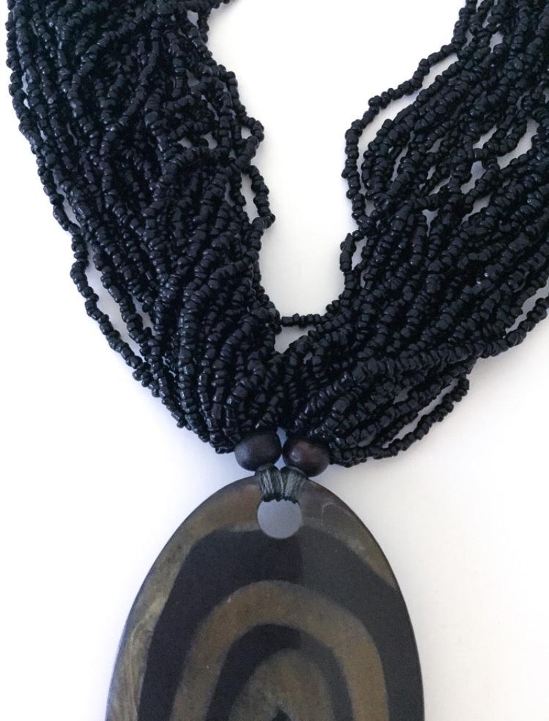 Black multi strand seed bead pendant statement necklace