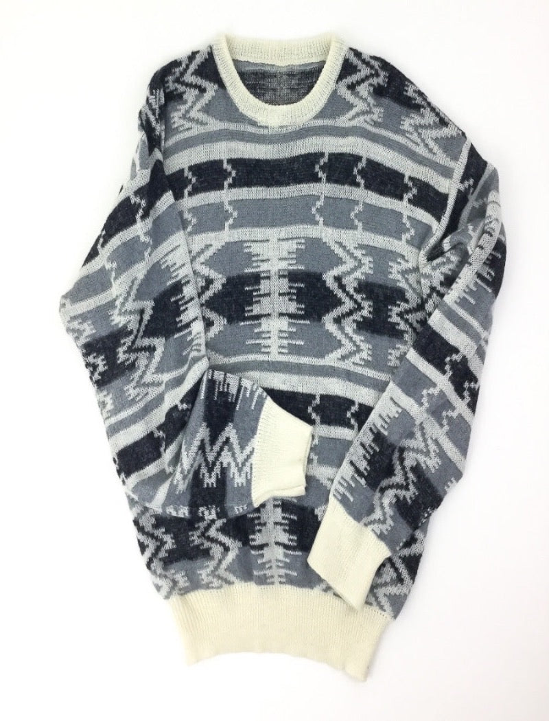 Grey and black aztec print unisex fine knit jumper with cream ribbed neckline, cuffs and hem