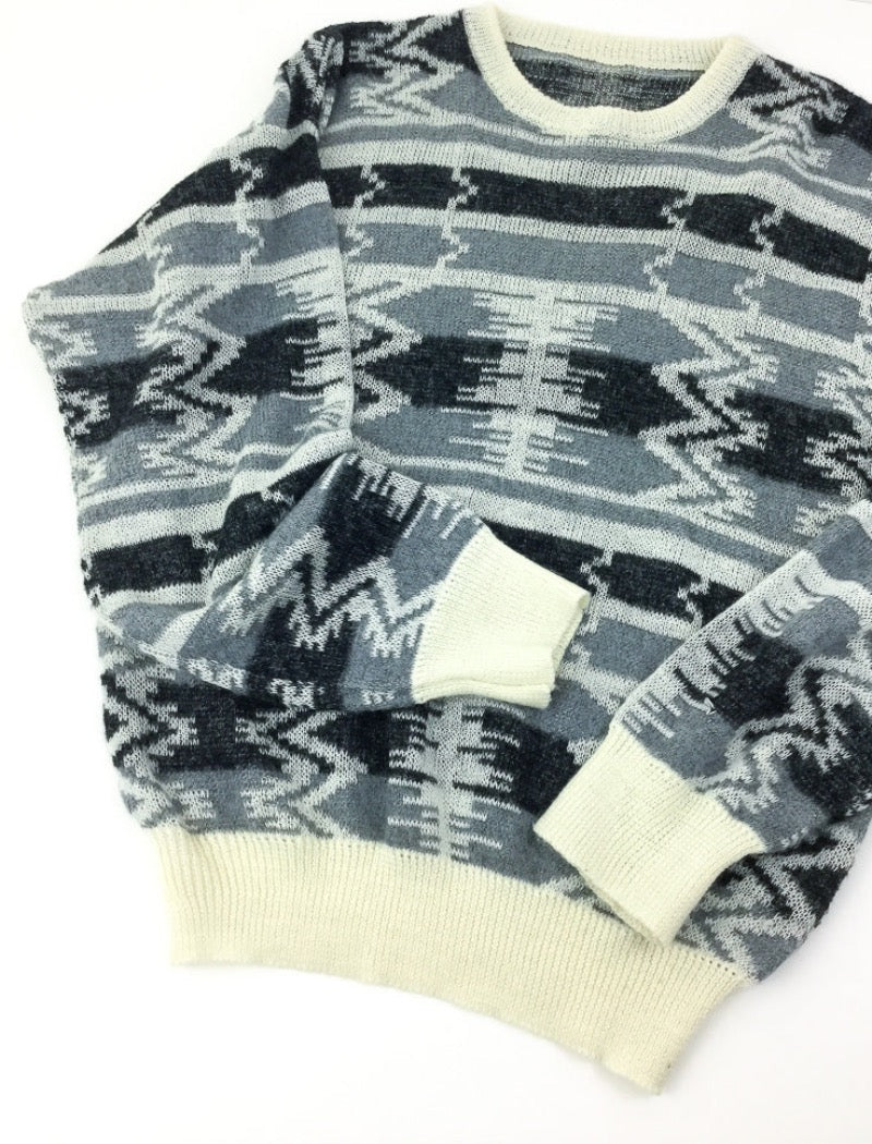 Grey and black aztec print unisex fine knit jumper with cream ribbed neckline, cuffs and hem