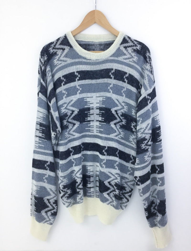 Grey and black aztec print unisex fine knit jumper with cream ribbed neckline, cuffs and hem