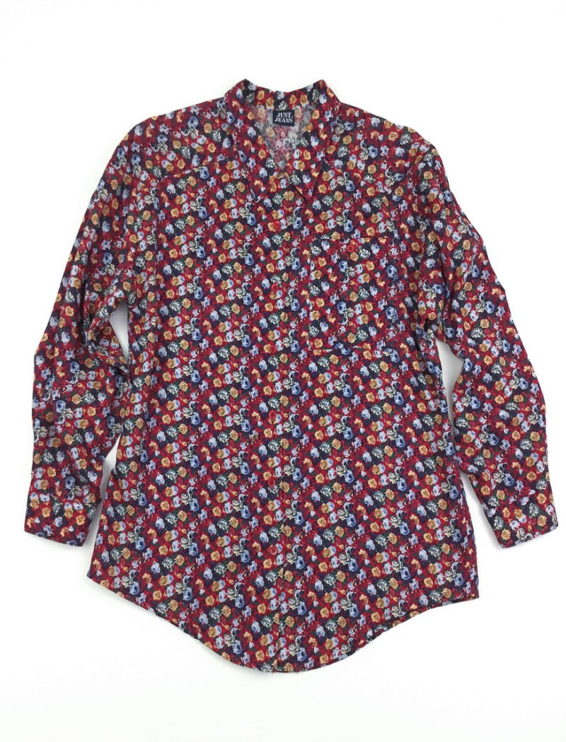 Vintage 90's boho floral print lightweight long sleeve shirt in reds, blues, brown & green. Has a pocket on the front left hand side with button closure all down the front.