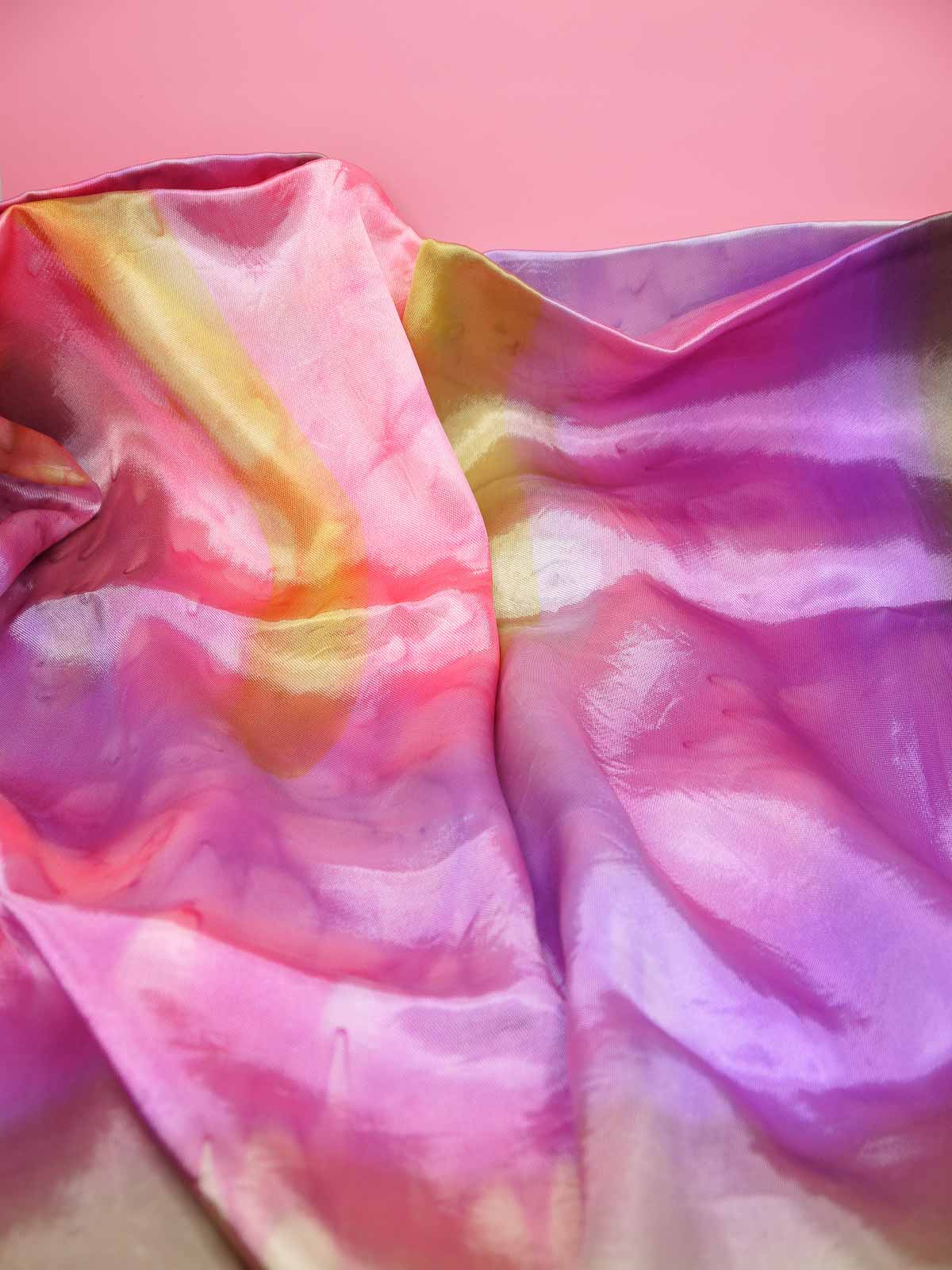 Tie dyed square fringed scarf shawl in colours of pinks, purples, gold with gold fringing and silky sheen to the fabric.